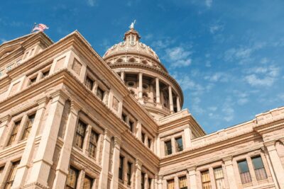 low-angle-shot-texas-capitol-building-blue-beautiful-sky-austin-city-texas_181624-3158